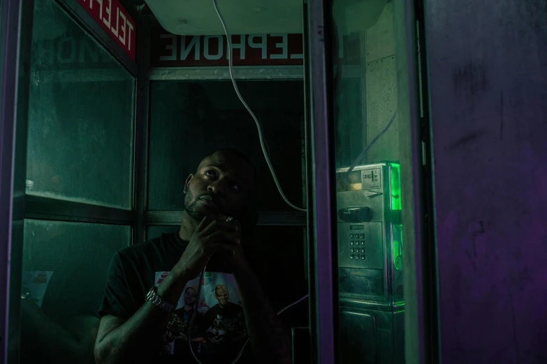 a man is sitting in a phone booth, inspired by Liam Wong, pexels contest winner, realism, lil uzi vert, translucent neon, portrait of jerma985, profile picture 1024px