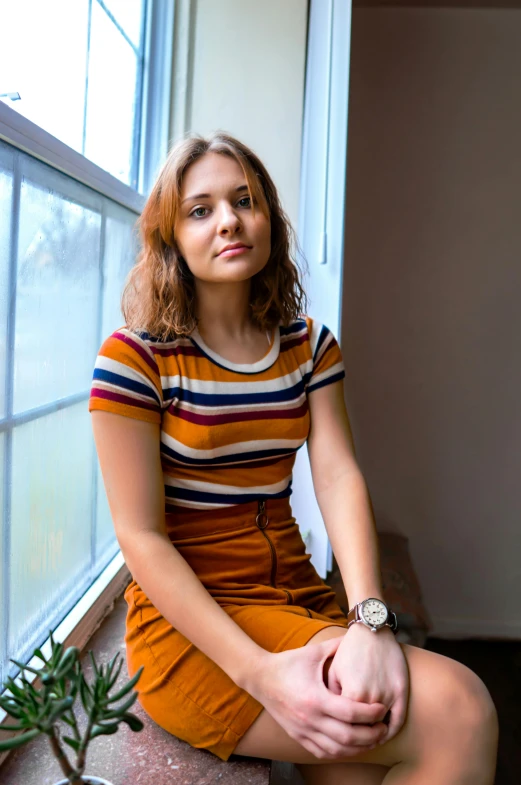 a woman sitting on a window sill next to a potted plant, a portrait, unsplash, wearing stripe shirt, hr ginger, multicoloured, andrea savchenko