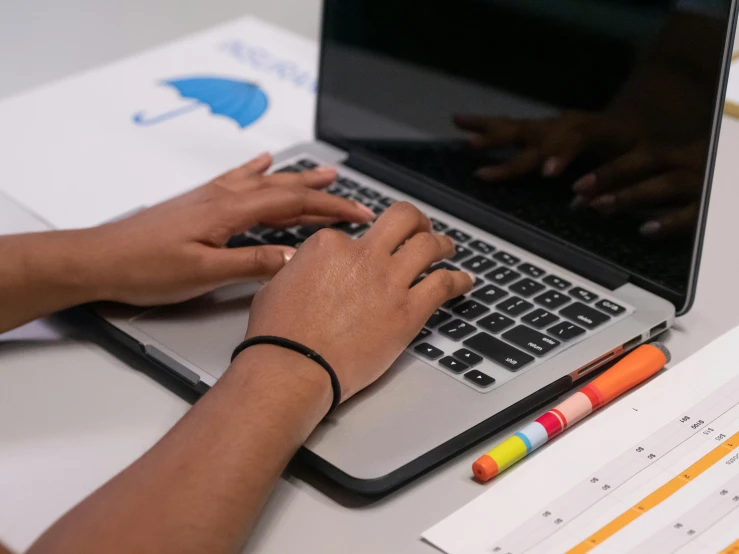 a person typing on a laptop computer on a desk, by Carey Morris, trending on unsplash, schools, coloured, 15081959 21121991 01012000 4k, high angle close up shot