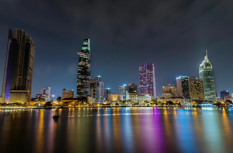 the city skyline is lit up at night, pexels contest winner, ao dai, square, low detailed, high quality image