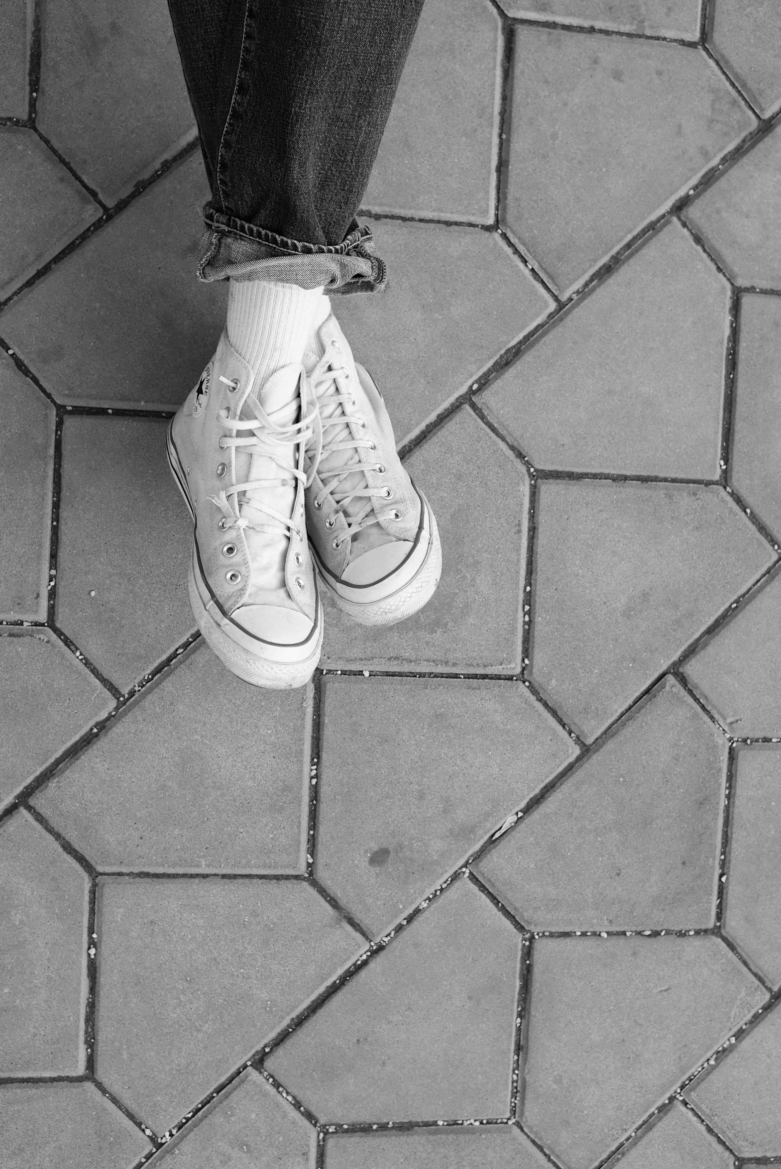 a black and white photo of a pair of sneakers, in a square, aesthetic!!!!!, bricks, pastel'