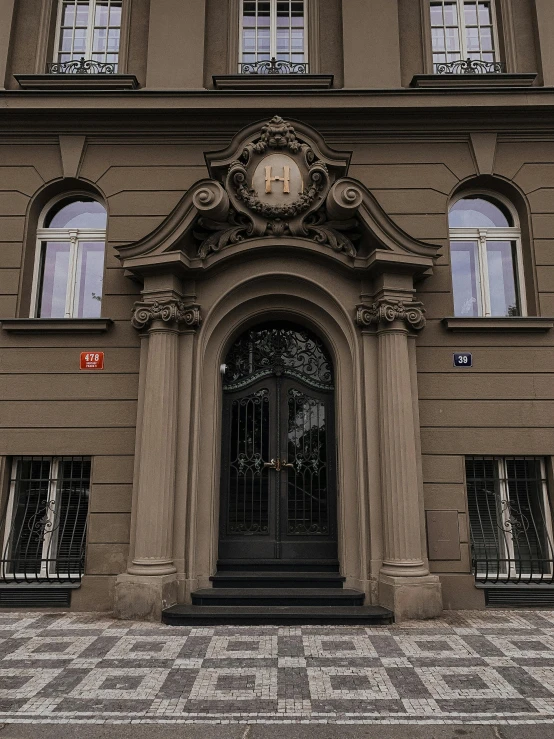 a building with a clock on the front of it, kramskoi 4 k, symmetrical doorway, profile image, private academy entrance