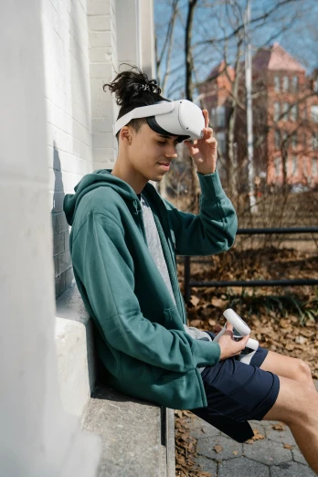 a young man sitting on the side of a building, wearing a vr headset, akali, wearing fitness gear, off - white collection