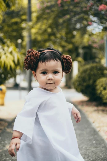 a little girl dressed as princess lei lei lei lei lei lei lei lei lei lei lei lei lei lei lei lei lei lei lei lei lei lei, inspired by Nyuju Stumpy Brown, pexels contest winner, realism, brown hair in two buns, portrait of princess leia, malaysian, in a street