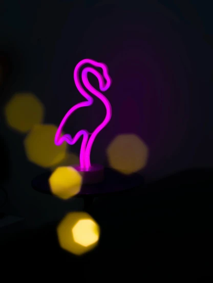 a neon flamingo sitting on top of a table, by Peter Alexander Hay, trending on pexels, mood light, soft light from the side, silhouette, detailed product image
