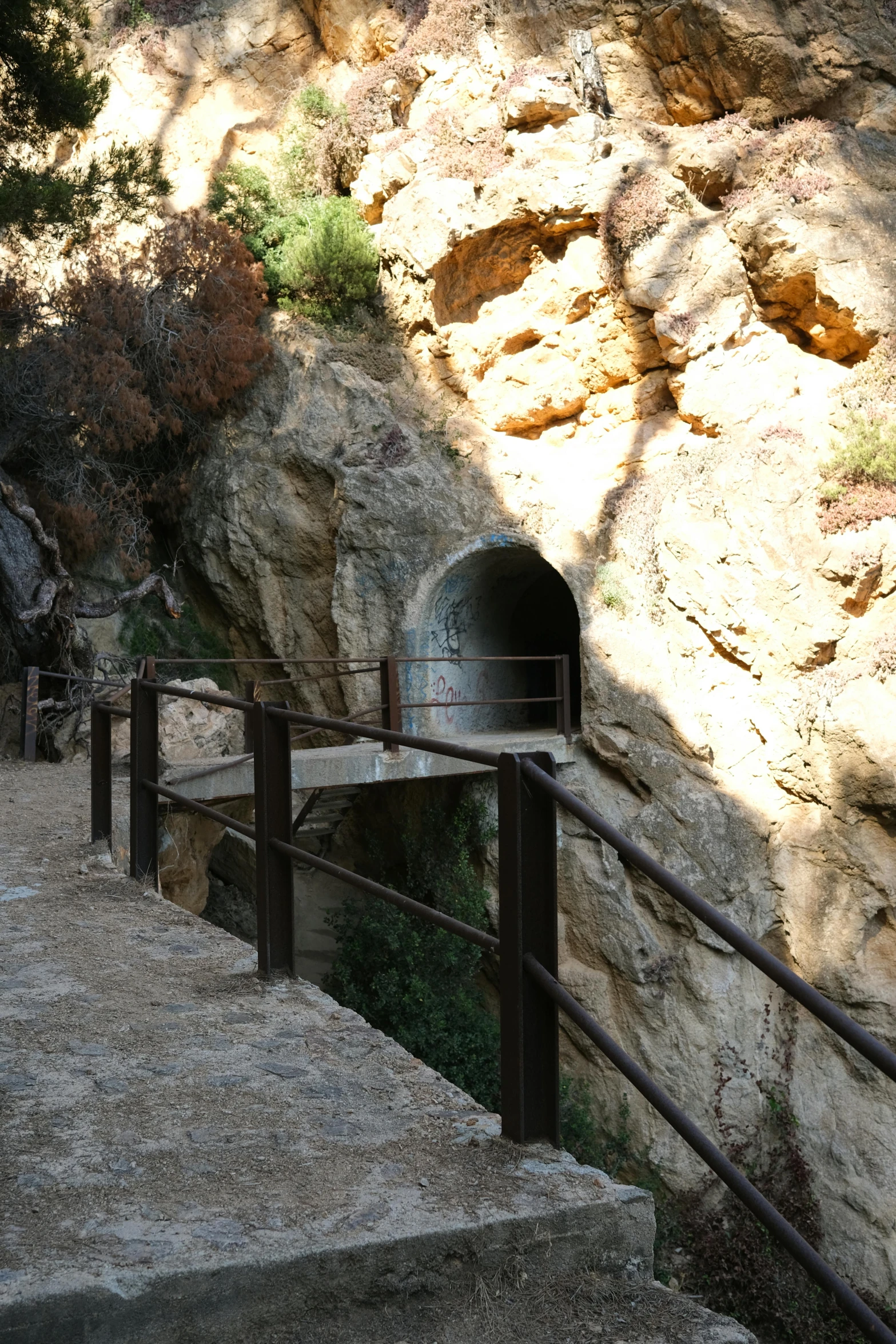 a group of people walking up a set of stairs, les nabis, empty bathhouse hidden in a cave, costa blanca, caves!, shrines