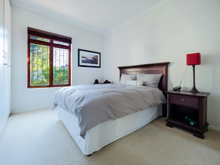 a bed sitting in a bedroom next to a window, profile image, top angle, listing image, white room