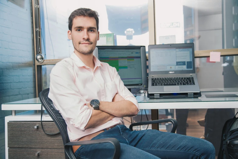 a man sitting at a desk in front of a laptop computer, by Adam Marczyński, looking confident, ben maier and sakimichan, avatar image, gigapixel photo