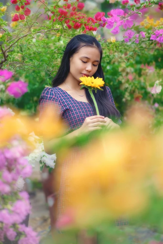 a woman holding a yellow flower in a garden, pexels contest winner, young asian woman, avatar image, thoughtful )