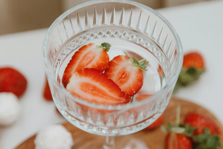 a glass of water with strawberries in it, by Adam Marczyński, pexels, renaissance, close up of single sugar crystal, high quality photo, fruit bowl, romantic themed