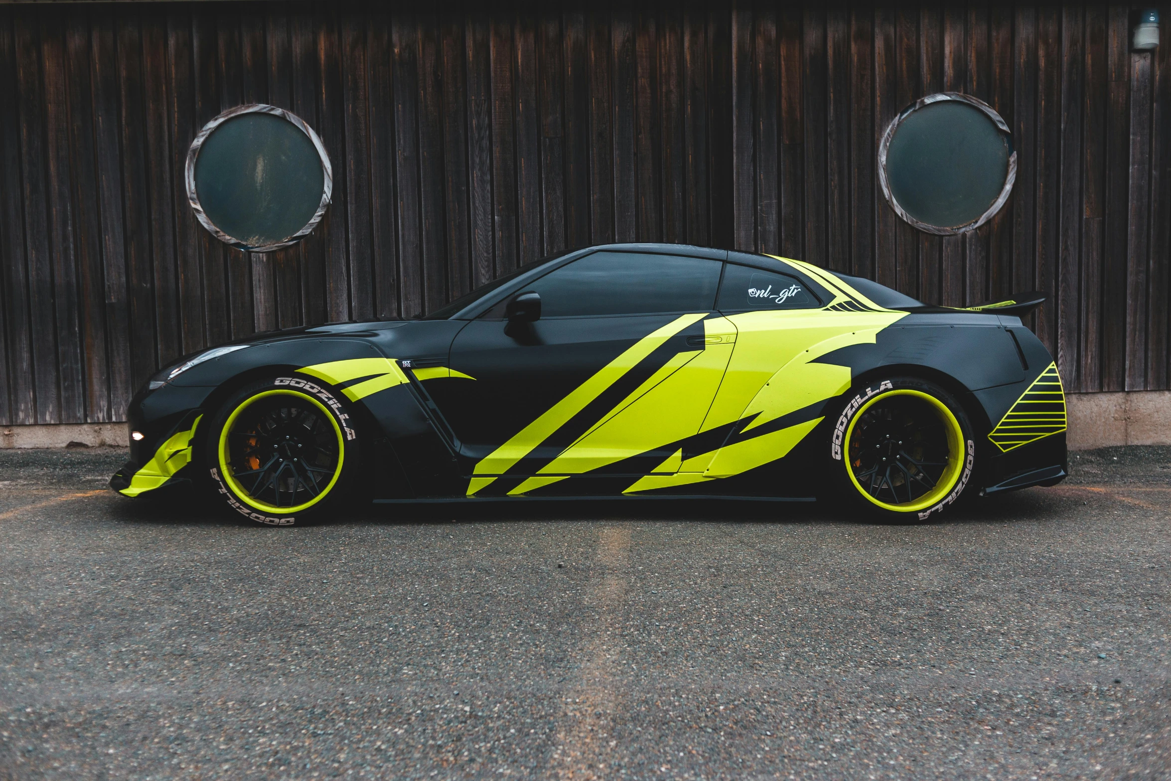 a yellow and black sports car parked in front of a building, inspired by An Gyeon, pexels contest winner, nuclear art, full body profile, samurai vinyl wrap, hyperrealistic n- 4, volcanic