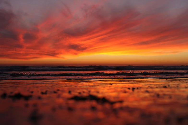 the sun is setting over the water at the beach, by Gwen Barnard, pexels contest winner, romanticism, fiery red, liquid gold, skybox, fire reflection