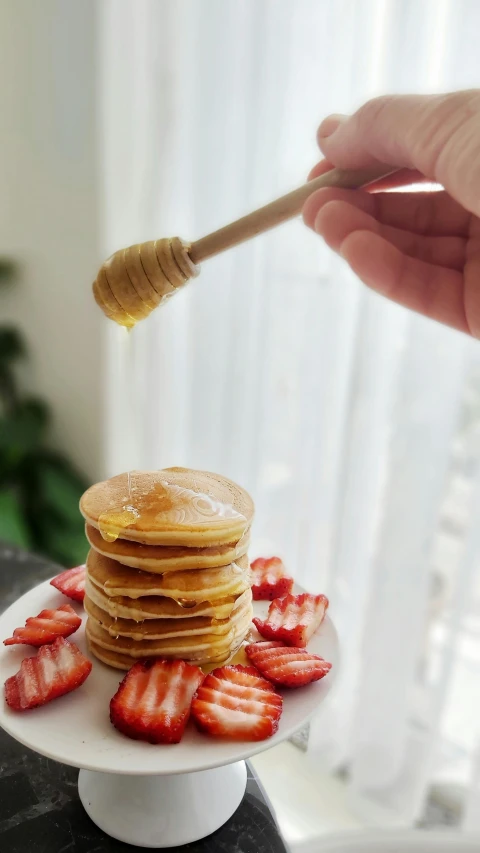a stack of pancakes sitting on top of a white plate, by Eleanor Best, pexels, hurufiyya, honey dripping from ceiling, thumbnail, mini, 8