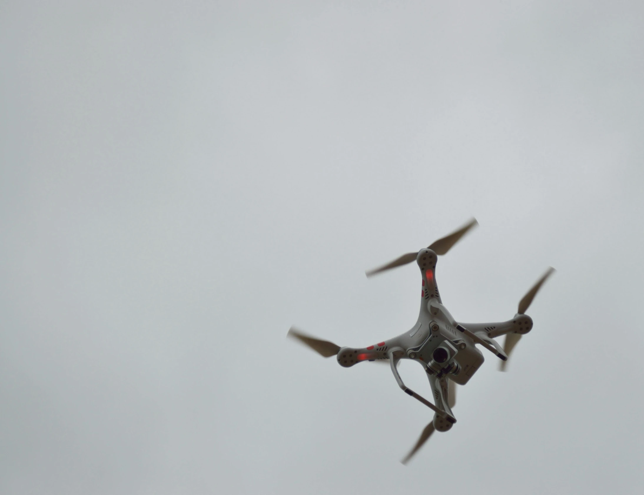 a close up of a drone flying in the sky, figuration libre, slight overcast weather, taken with sony alpha 9, square, [ realistic photo ]!!