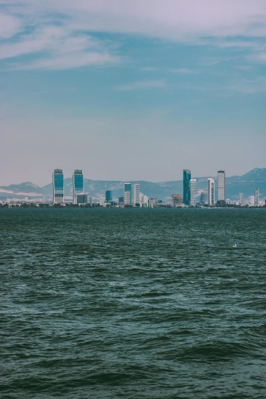 a large body of water with a city in the background, view from the sea, view(full body + zoomed out), postprocessed), 8k))