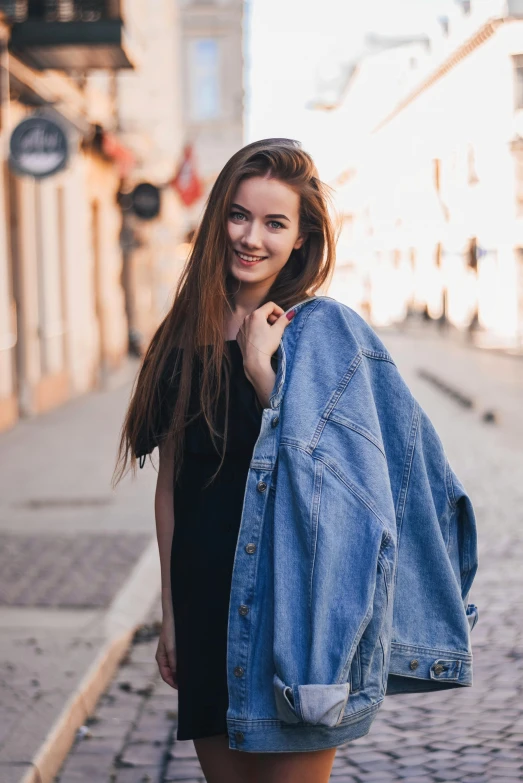 a woman in a black dress and a denim jacket, pexels contest winner, cute casual streetwear, portrait of sanna marin, 15081959 21121991 01012000 4k, snapshot