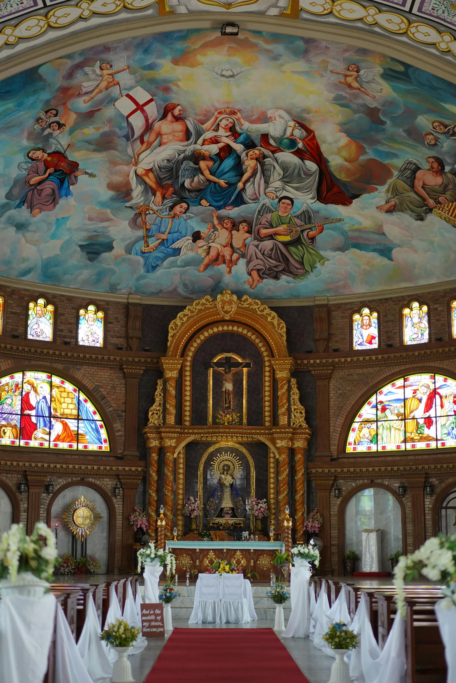 a church with a painting on the ceiling, inspired by Francisco de Burgos Mantilla, philippines, opal statues adorned in jewels, rotunda, sitting