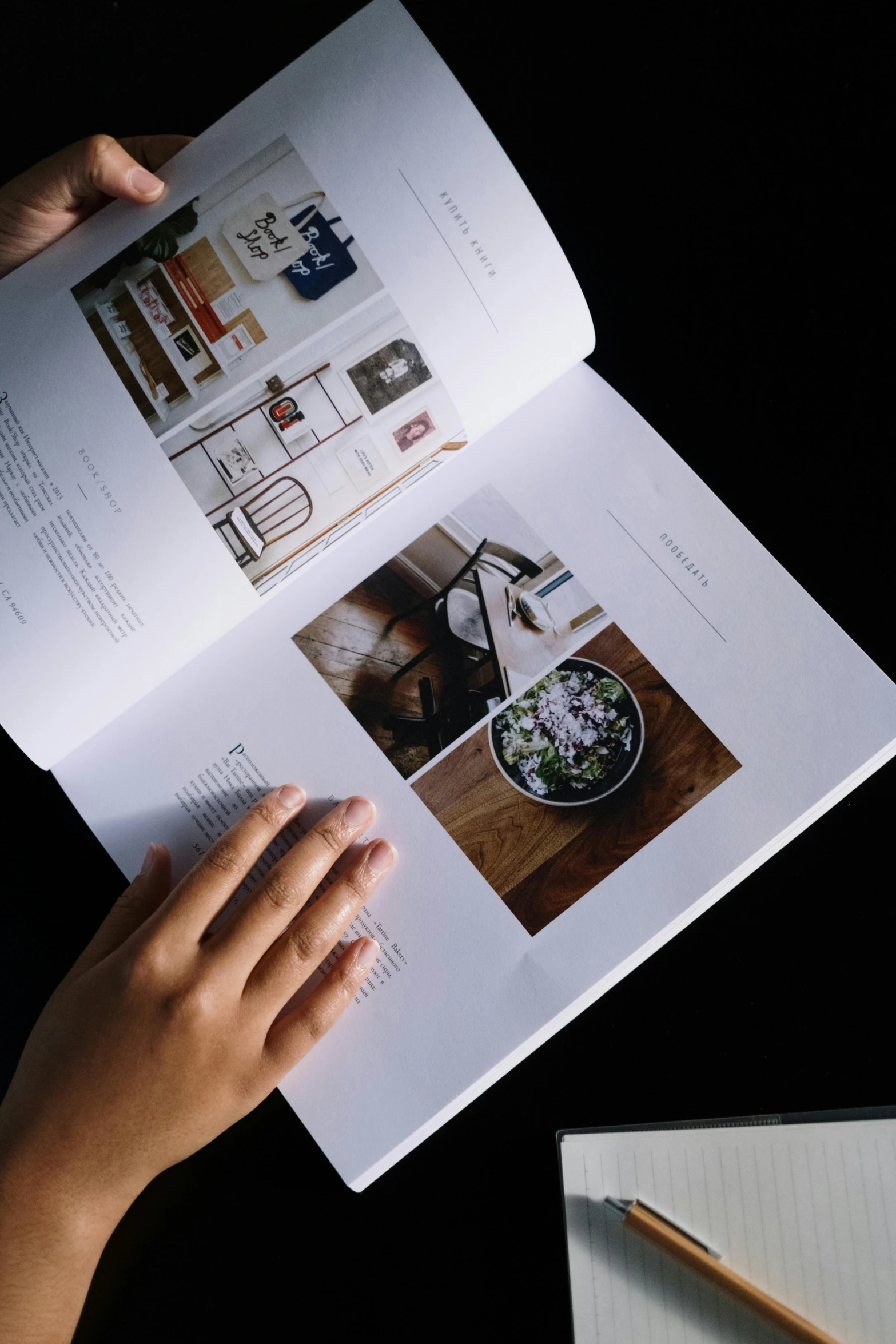 a person reading a book next to a cup of coffee, a picture, unsplash, visual art, catalog print, with a black background, on a white table, detailed information