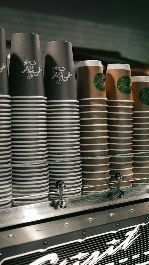 a row of coffee cups sitting on top of a coffee machine, a screenshot, by Austin English, pexels, pbr, stacked image, multiple stories, photo for a store