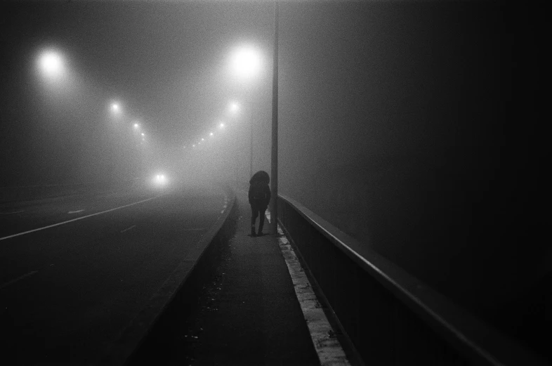 a person walking across a bridge on a foggy night, by Gusztáv Kelety, oleg korolev, portait image