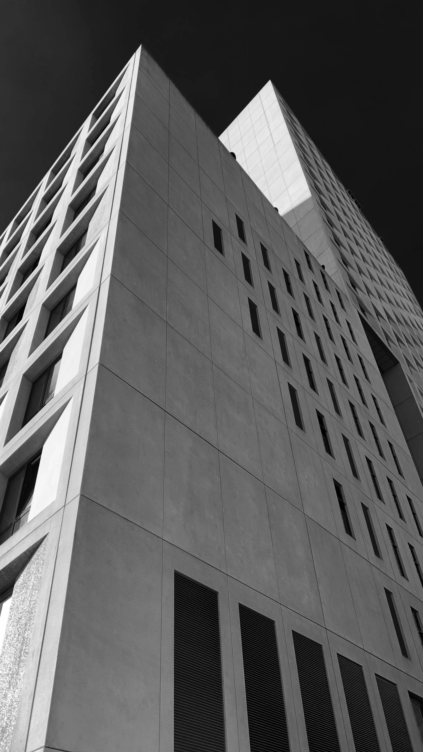 a black and white photo of a tall building, inspired by David Chipperfield, gray concrete, photo”, square, ap news photo