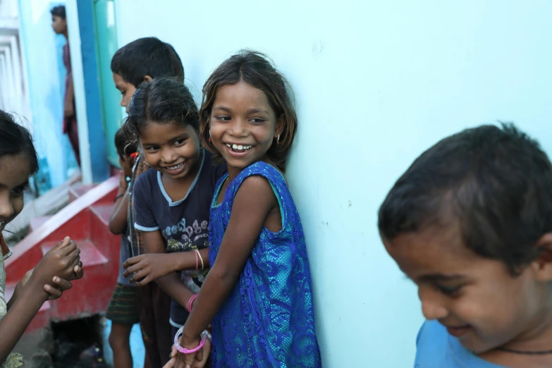 a group of children standing next to each other, pexels contest winner, bengal school of art, smiling at each other, avatar image, thumbnail, slum