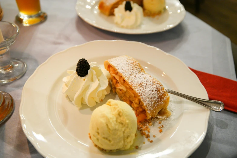 a close up of a plate of food on a table, desserts, whipped cream, thumbnail, stuffed