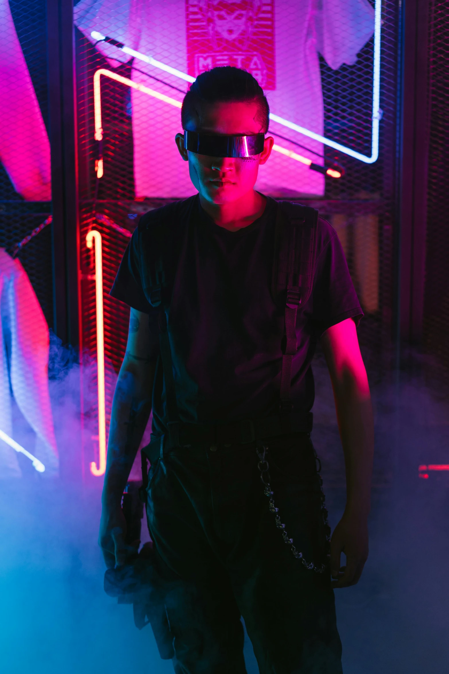 a man standing in front of a neon sign, cyberpunk art, pexels contest winner, he wears dark visors, in a nightclub, vitalik buterin, standing in a server room