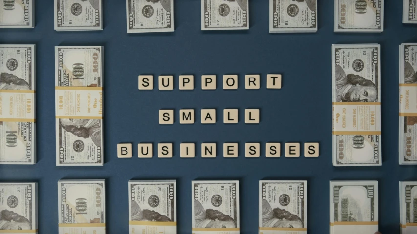 a wall with scrabbles spelling support small businesses, 1 0, mini model, ad image, thumbnail