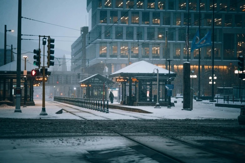 a train station in the middle of a snowy city, by Brian Snøddy, unsplash contest winner, hyperrealism, square, snowstorm ::5, brown, trams