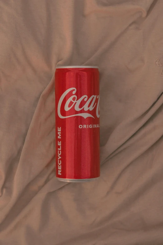 a can of coca sitting on top of a bed, unsplash, hyperrealism, ignant, lofi hip hop, tans, red velvet