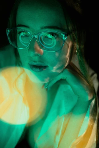 a close up of a person wearing glasses, inspired by Elsa Bleda, digital art, bioluminescent orbs, experimenting in her science lab, chartreuse and orange and cyan, student