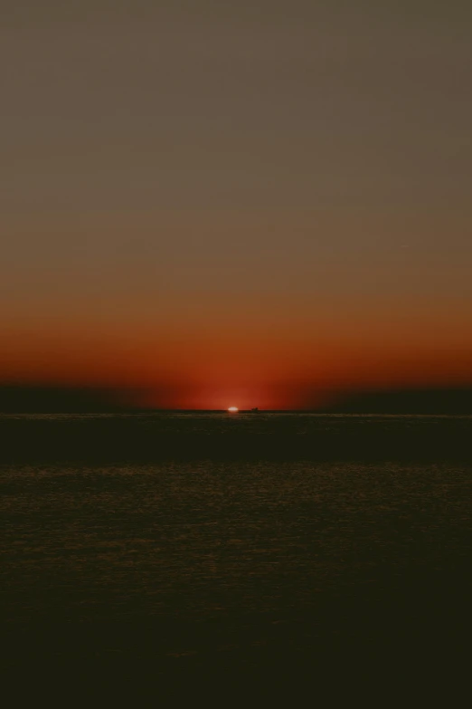 the sun is setting over a body of water, by Attila Meszlenyi, fading off into the distance, sydney hanson, digital image, red sea