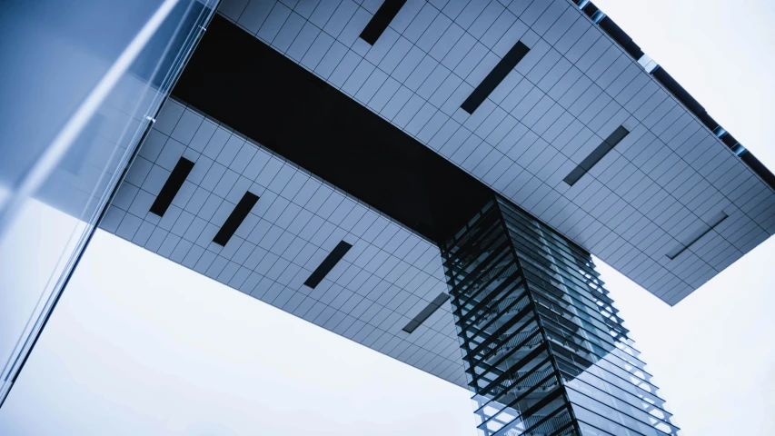 a black and white photo of a tall building, inspired by Tadao Ando, unsplash, square lines, canopies, upside - down building, morphosis