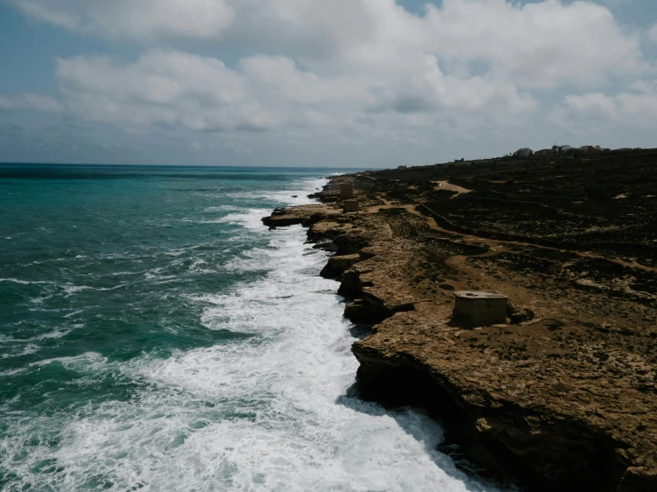 a view of the ocean from the top of a cliff, pexels contest winner, les nabis, somalia, erosion algorithm landscape, puerto rico, wall of water either side