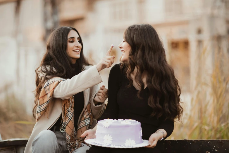 a couple of women standing next to a cake, trending on pexels, violet long hair, happy friend, brunettes, thumbnail