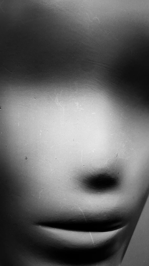 a black and white photo of a woman's face, by Ai-Mitsu, conceptual art, slenderman, square nose, blurry image, pose 4 of 1 6