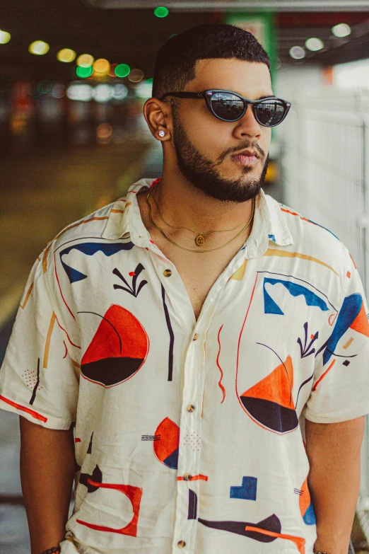 a man wearing sunglasses standing in front of a train, inspired by Michael Ray Charles, trending on pexels, graffiti, wearing a linen shirt, geometrical, plus size, caio santos