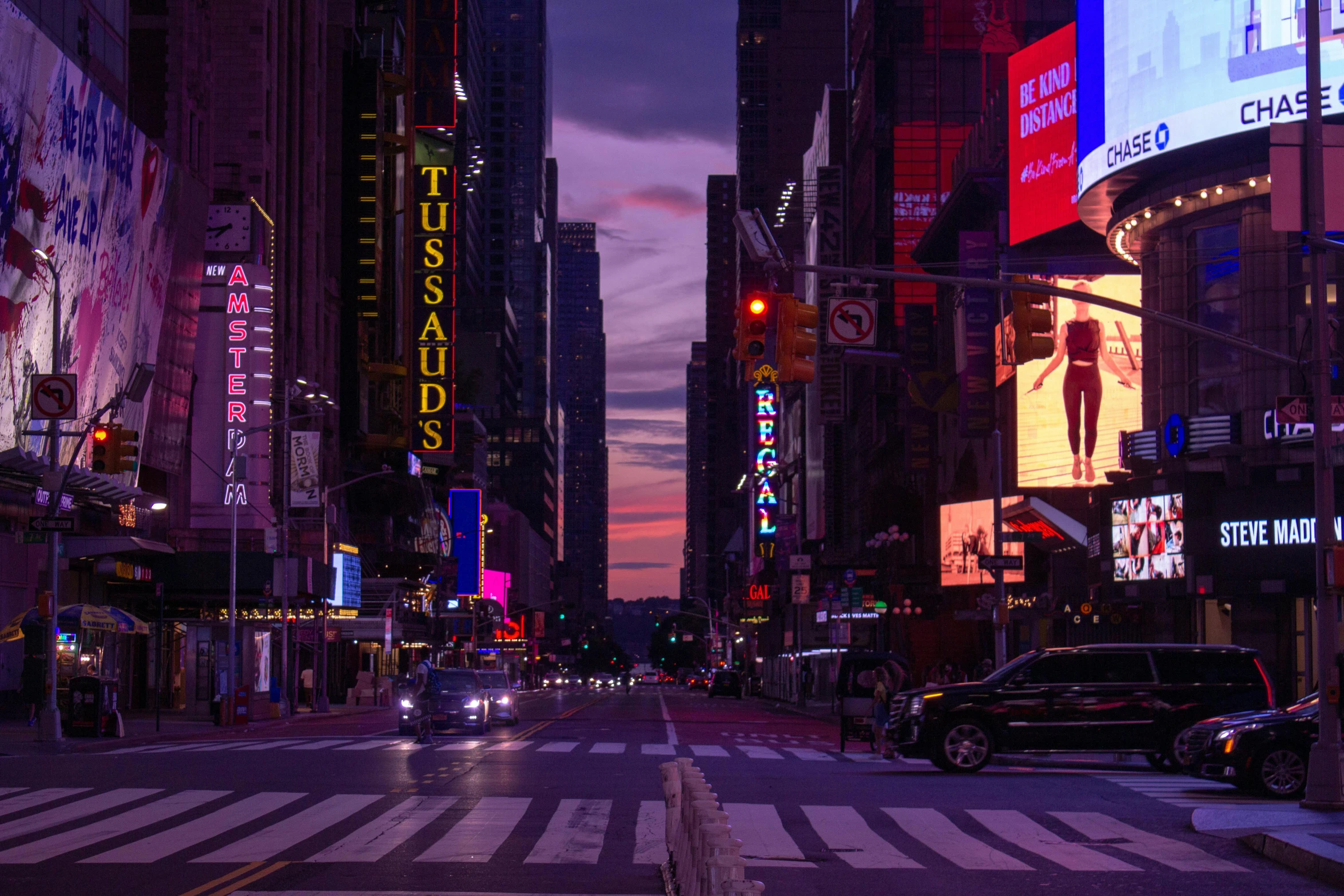 a city street filled with lots of traffic next to tall buildings, by Emanuel Witz, pexels contest winner, pink yellow and blue neon signs, ny, purple glow, late morning