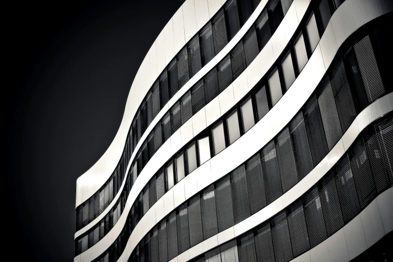 a black and white photo of a building, inspired by Zaha Hadid, unsplash, bauhaus, hannover, very detailed curve, square lines, 8k fine art photography