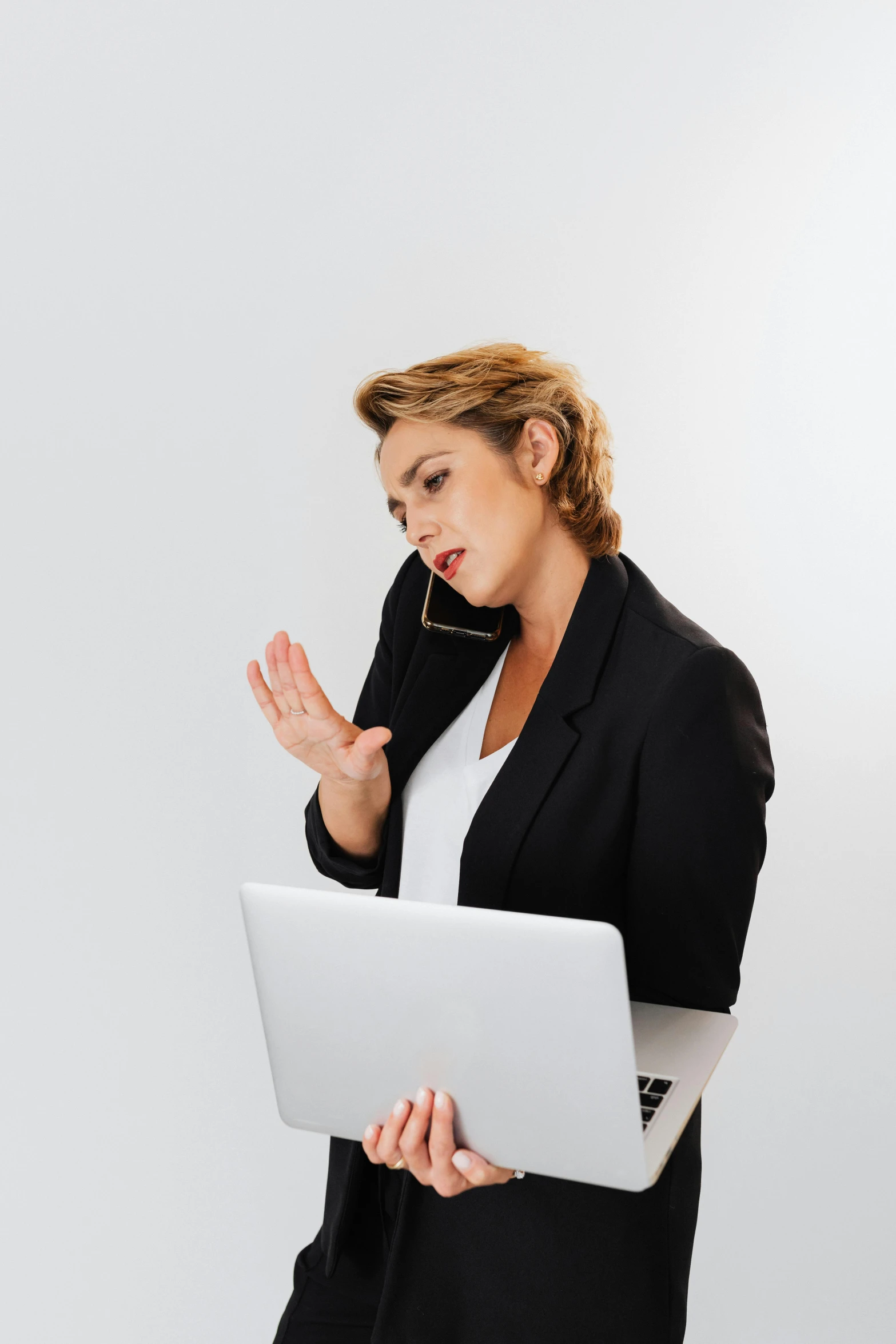 a woman in a business suit holding a laptop, trending on pexels, renaissance, arguing, working in a call center, slightly minimal, stacked image