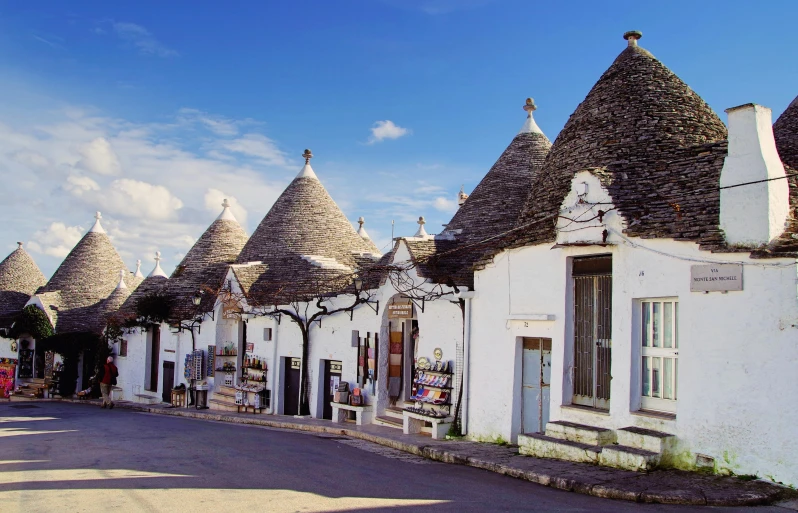 a street lined with white buildings with conical roofs, pexels contest winner, renaissance, trulli, fan favorite, square, postprocessed