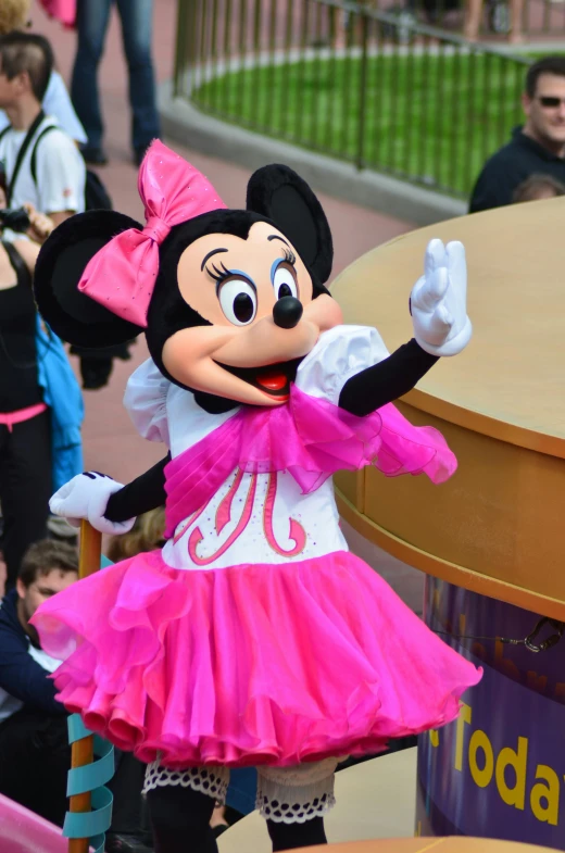 a person dressed in a minnie mouse costume, a cartoon, flickr, pink iconic character, square, 2263539546], performing