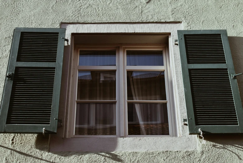 a close up of a window with green shutters, pexels contest winner, photo of zurich, soft window light, fake windows, brown