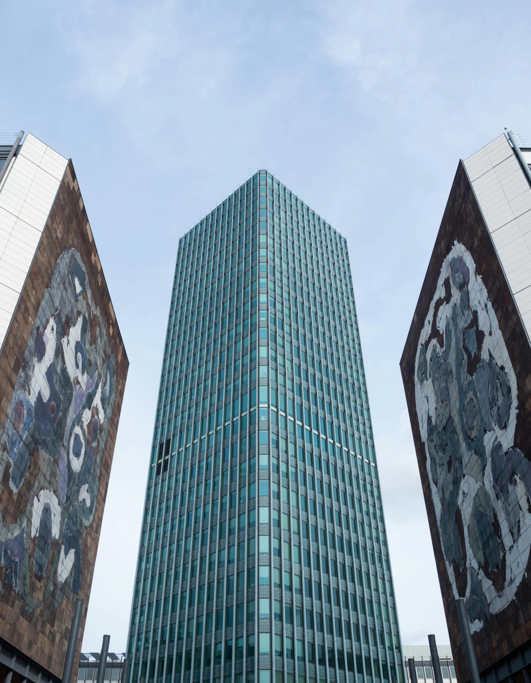 a group of tall buildings sitting next to each other, an album cover, inspired by Karel Dujardin, pexels contest winner, brutalism, madrid, three towers, utrecht, outside view