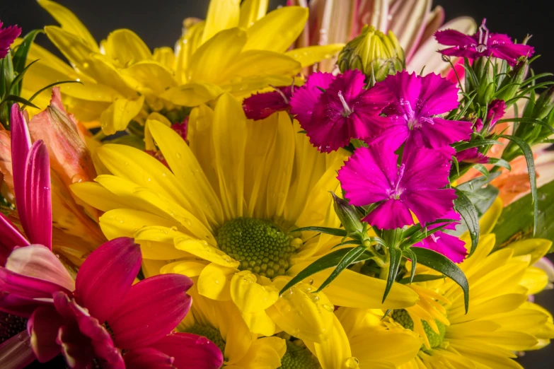 a close up of a bunch of flowers in a vase, photo taken with provia, pink yellow flowers, colors: yellow, medium closeup