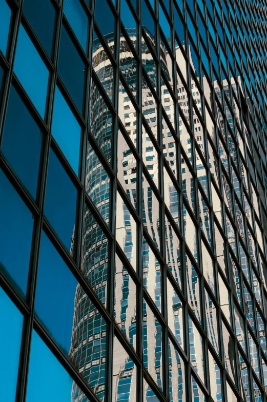 a tall building is reflected in the windows of another building, pexels contest winner, chicago, dynamic closeup, square lines, hyperdetailed