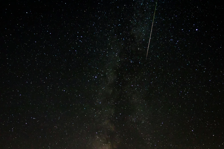 a sky filled with lots of stars next to a forest, by Niko Henrichon, pexels, hurufiyya, shining meteor, space station planet afar, fireball, mint