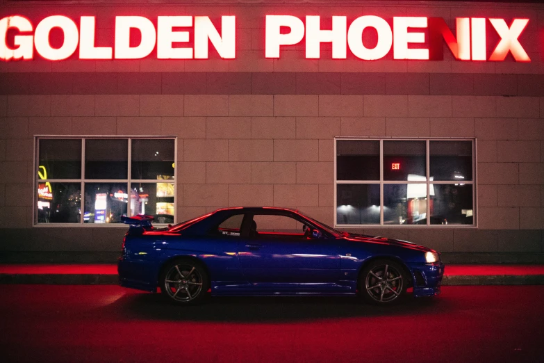 a blue car parked in front of a building, an album cover, inspired by Hiroshi Honda, unsplash contest winner, well lit night in las vegas, the phoenix, red and obsidian neon, jdm