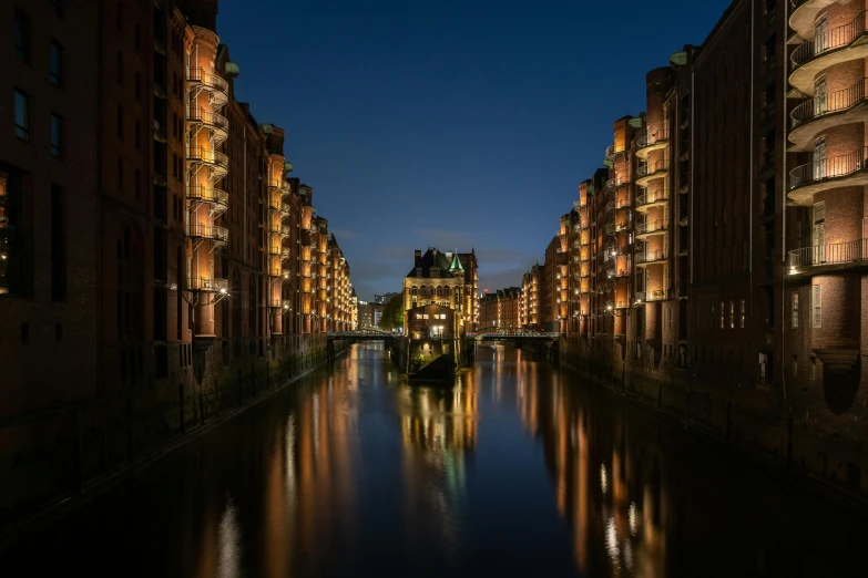 a river running through a city next to tall buildings, by Tobias Stimmer, pexels contest winner, hyperrealism, victorian harbour night, lower saxony, berghain, perfect symmetrical image
